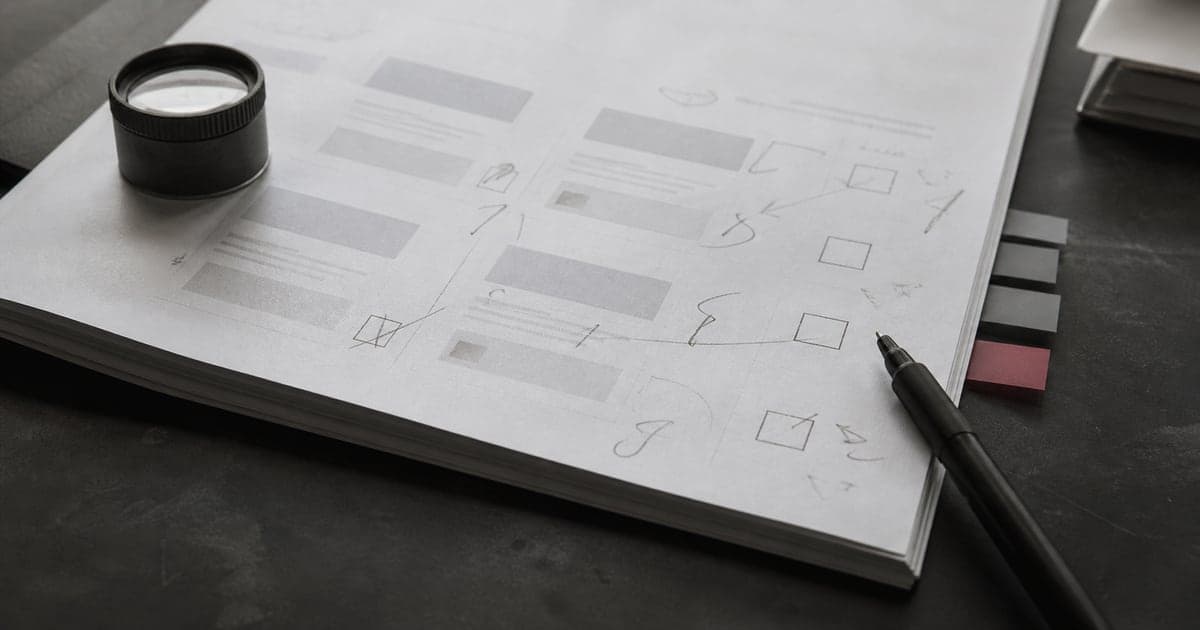 A printed agency proposal covered with precise handwritten review notes