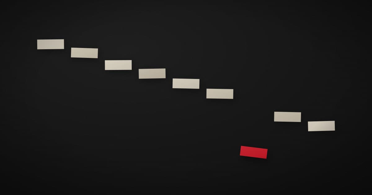 A stepped line of pale paper cards descending across a dark surface, with one crimson card sitting below the line